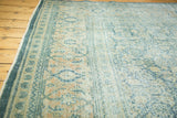 Distressed vintage Mahal carpet border, featuring teal, terra cotta, and ivory turtle-samovar motifs.