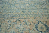 Detail of distressed vintage Mahal rug, intricate Herati motif, teal and terra cotta.