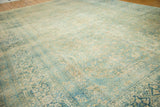 Vintage Distressed Meshed Carpet border detail with faded floral cartouches in pale blue and gold.