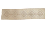 Distressed vintage Oushak runner with ivory, beige, and silver geometric medallions, 3x12.