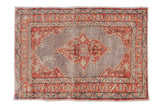 Distressed vintage Oushak rug with curvilinear medallion, pale cherry red borders, and faded silver-gray field.