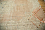 Distressed Oushak carpet texture with even wear, exposed foundation, and soft blush, ivory hues.