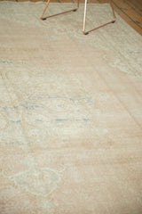 Even wear across to knot heads on a distressed Oushak rug in pale blush, ivory, and blue.