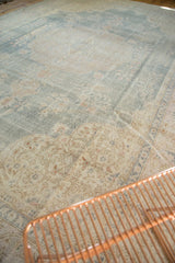 Distressed Oushak carpet corner with rococo arabesques, floral motifs in antique ivory, powder blue.