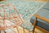 Distressed vintage Oushak carpet with faded ocean blue green and ivory palmette pattern.