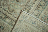 Vintage distressed Mahal carpet fold displaying worn Herati pattern, knot heads, and secured edge.