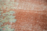 Distressed hand knotted Arak carpet pile with rust and faded floral motifs, visible foundation.