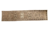 Vintage Northwest Persian rug runner, central medallions with vinery, charcoal, and ivory tones.
