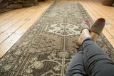 Runner with single column vinery medallions in gray, silver, and ivory tones.