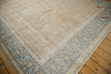 Distressed corner of vintage Meshed carpet, blush field and faded blue border motifs.