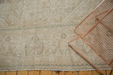 Detail of distressed Mahal carpet with even wear exposing foundation and subtle trefoil patterns.