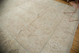 Distressed vintage Mahal carpet texture with dusty beige Herati motif and subtle blue border detail.