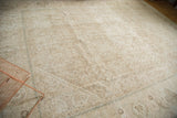 Distressed Mahal carpet with muted Herati pattern and visible foundation texture.