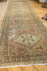 Distressed blush and brown geometric patterns with even wear on a vintage Serab runner.