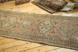 Distressed geometric medallions and border details on a vintage Serab runner in blush and brown.