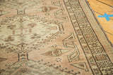 Distressed Serab runner, geometric patterns, and blush, peach, brown decorative border.