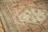 Distressed Serab runner showing geometric medallion, time-softened blush, peach, and ivory tones.