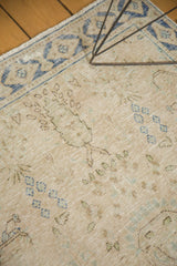 Faded floral motifs and visible foundation across the distressed vintage Meshed rug.