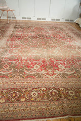 Distressed vintage Persian Tabriz rug border with softened red and ivory Herati motifs.