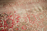Distressed Persian Tabriz carpet showcasing worn Herati motif, visible foundation, and time-softened colors.
