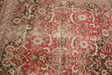 Distressed vintage Tabriz rug with worn black cherry red Herati design, foundation visible.