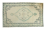 Vintage Distressed Oushak carpet with a central medallion, muted green and blue patterns, 6x9 feet.