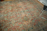 Vintage distressed Mahal carpet, its textured field in terra cotta, teal, and curvilinear florals.