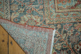 Corner of hand-knotted vintage Mahal carpet showing foundation and distressed terra cotta florals.