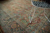 Vintage Distressed Mahal carpet corner, revealing curvilinear florals in terra cotta, teal, and ivory hues.