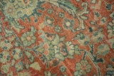 Distressed Mahal carpet pile with terra cotta, sea foam green, and teal curvilinear floral motifs.