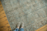 Distressed vintage Tabriz carpet with even wear, faded allover floral pattern, and muted tones.