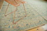 Distressed vintage Tabriz carpet, showing faded Herati motif and scrolling vinery border.