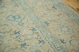 Distressed Tabriz carpet texture with faded sky blue Herati motif and even wear.