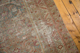 Distressed character and exposed foundation of the antique Malayer runner with nuanced herati motifs.