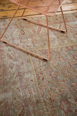 Faded aubergine and slate blue Herati motif on the distressed antique Malayer rug.