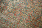 Distressed texture and even wear of the Herati motif with faded slate blue and wine red.