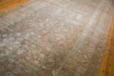 Distressed antique Malayer rug detail: faded herati motifs, knot head wear, exposed foundation.