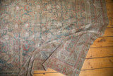 Distressed antique Malayer rug with faded slate blue, pale red Herati pattern and exposed foundation.