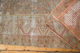 Distressed Antique Malayer runner showcasing worn Herati pattern, exposed foundation, and faded tones.