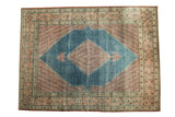 Distressed vintage Mahal carpet, watery blue diamond medallion, and floral pomegranate red patterns.