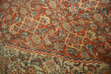 Antique Persian Mahal rug detail: rich terra cotta field, repeating Herati motif in blue, ivory.