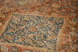 Antique Mahal rug detail: low pile, blue stepped medallion, and terra cotta Herati pattern.