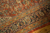 Antique Persian Mahal carpet with rich rust Herati pattern and classic navy turtle border.