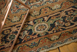 Low pile antique Mahal, featuring Herati motif in terra cotta, navy, and oxidized copper green.