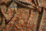 Detail of antique Mahal rug, featuring Herati motif in rich terra cotta and varied blue tones.