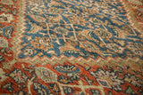 Antique Mahal rug's low pile texture, revealing intricate Herati pattern in terra cotta and blue.