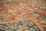 Low pile texture with terra cotta and blue Herati motifs on the antique Mahal.