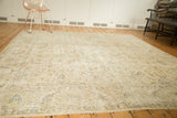 Vintage distressed Sparta carpet's allover ivory and beige pattern with oxidized silver tones.