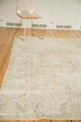 Distressed hand-knotted Sparta carpet section, featuring faded ivory, beige, and silver allover patterns.