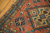 Terra cotta field detail of a Vintage Heriz rug with geometric cross-section motifs.
